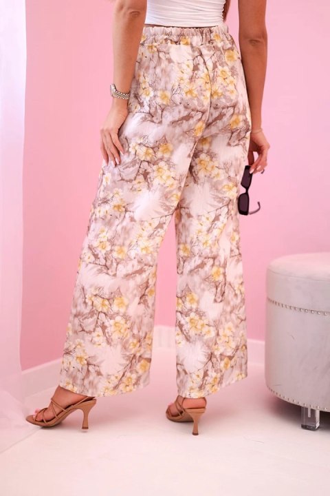 Spodnie z szeroką nogawką w kwiaty beżowo żółte